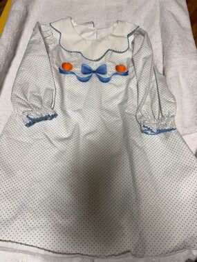 Classic White Polka Dot Girls Dress with Blue Trim and Orange Accents
